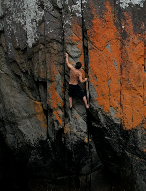 Deepwater soloing on seacliffs near Blackmans Bay Tasmania, Australia