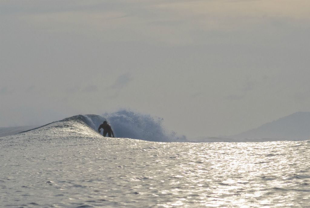 Surfing at Pailongge reef Gizo, Solomon Islands