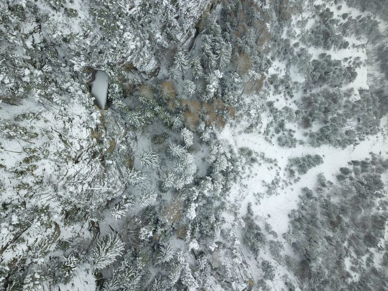 Eagle's eye view of the snowy mountain road from Niederhorn to Thun, Switzerland